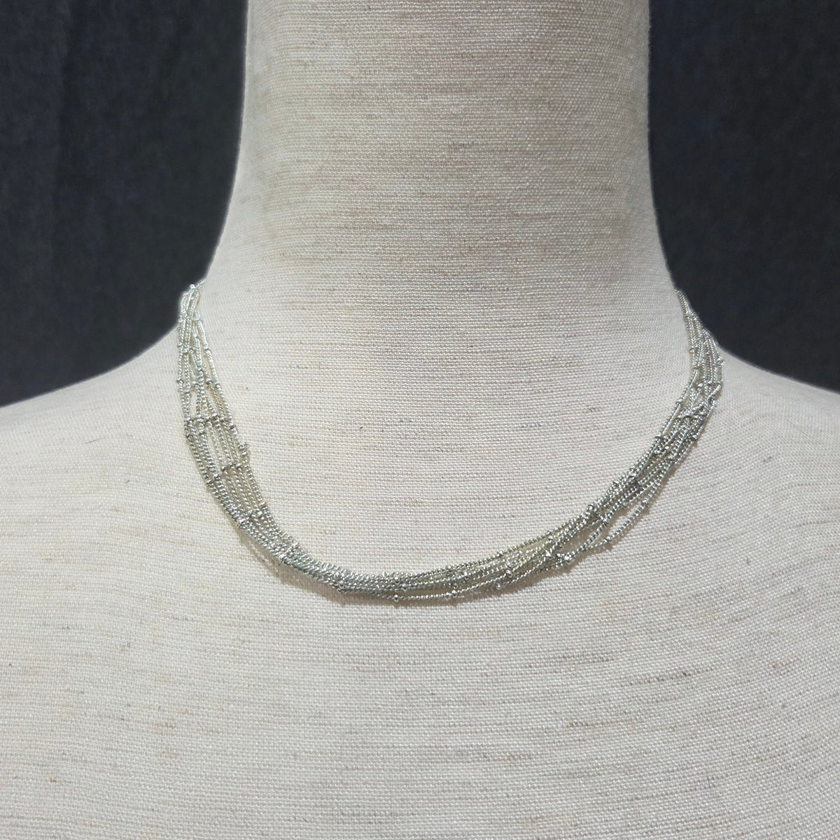 apostrophe | multistrand silver toned necklace